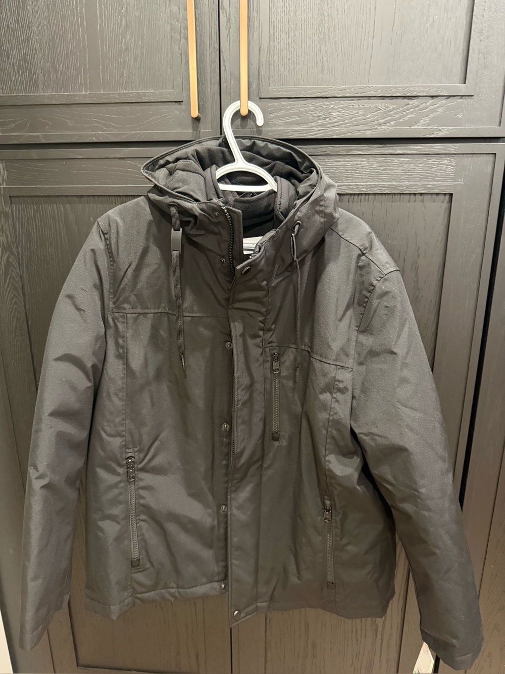 NWT Calvin Klein Black Hooded 3 in 1 Jkt/Coat.
3 in 1 Jkt/Coat